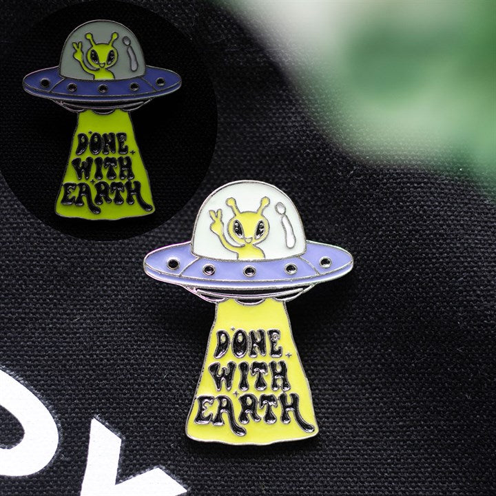 Camp Cryptid: Glow in the Dark UFO Pin Badge