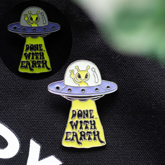 Camp Cryptid: Glow in the Dark UFO Pin Badge